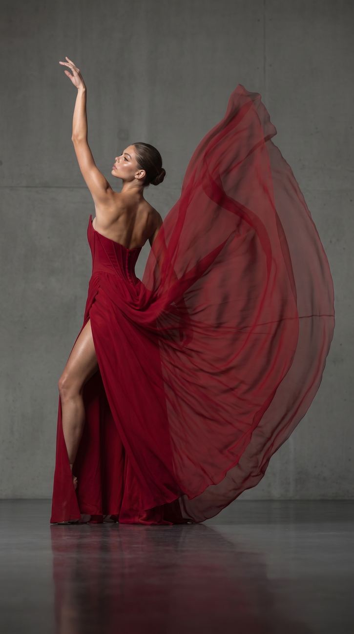 arm raised, fabric still in motion